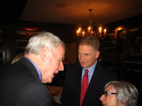 Tom Barrett, Sheldon Wasserman, and a supporter chat during a Lassa fundraiser.