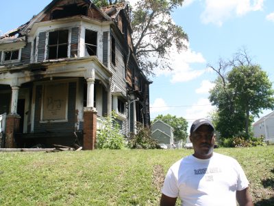 Activists Clean Up Around Burned House As Questions Remain