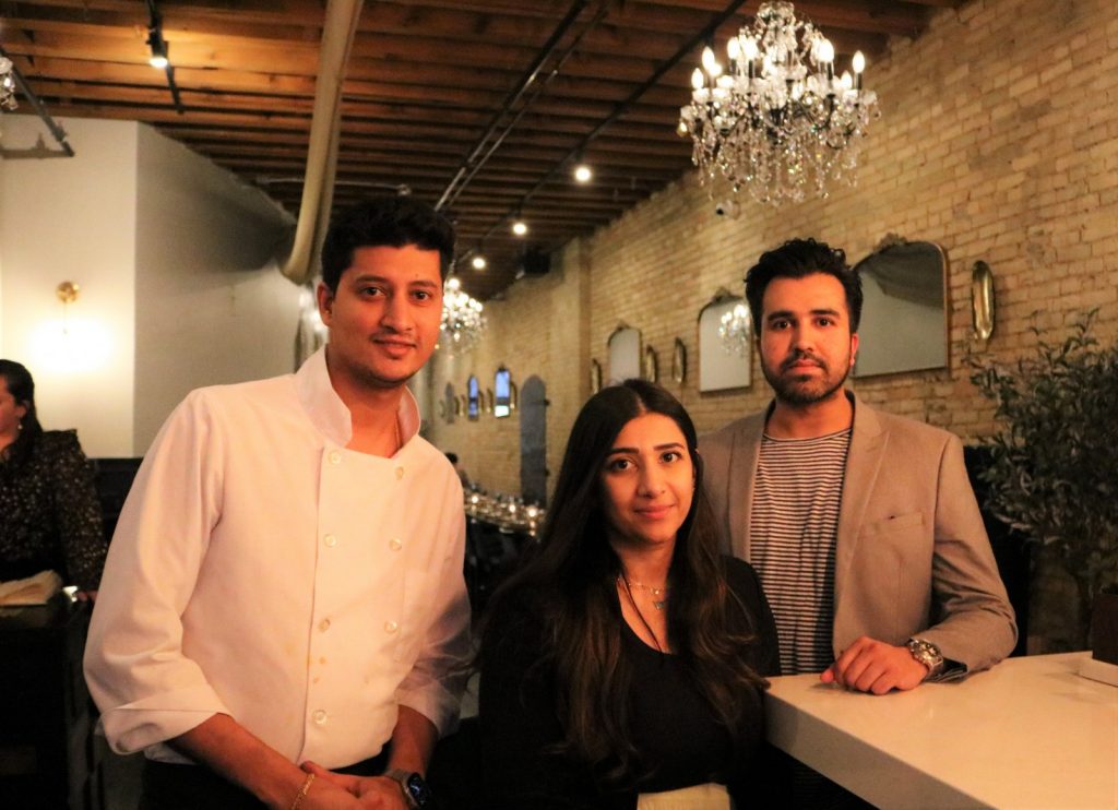 Chef Abhishek Patil (left), Fatima Kumar and Hanish Kumar. Photo taken Feb. 27, 2023 by Sophie Bolich.